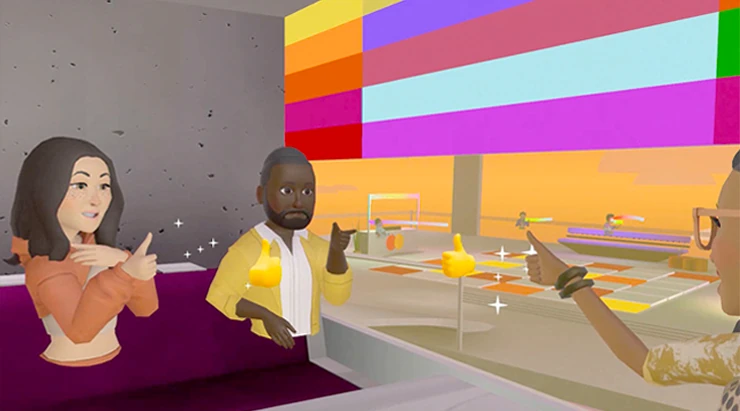 Visitors share a conversation in a bright community lounge
