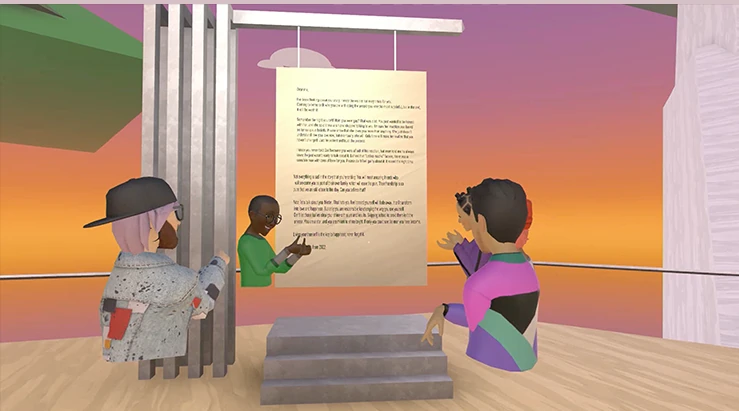 Visitors read a letter together in the exhibition