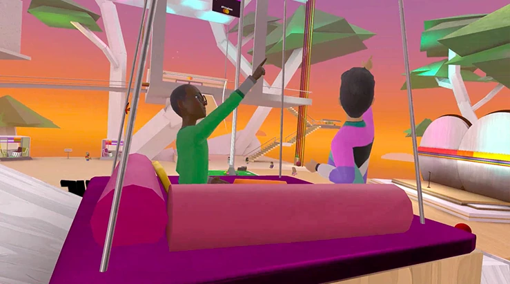 Visitors sit together on a swing in the world